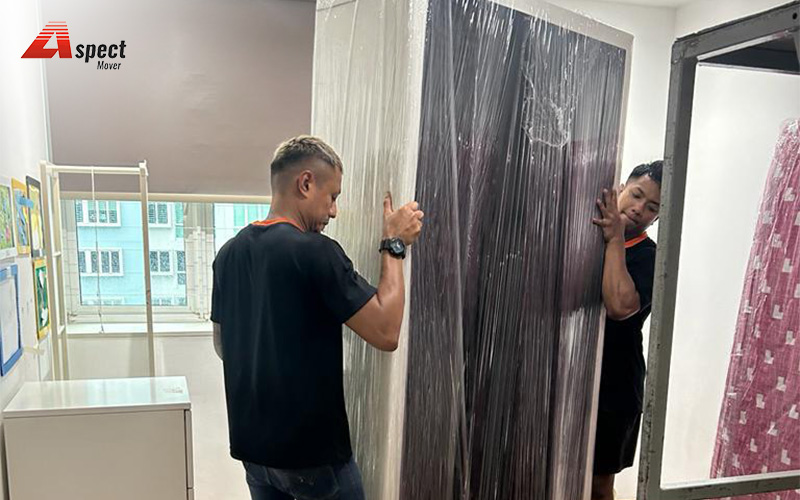 Aspect Mover lifting a large, wrapped wardrobe.